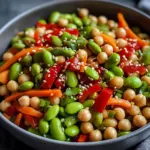 Chickpea Edamame Salad with Ginger Sesame Vinaigrette served in a bowl