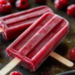 Delicious homemade cherry ice pops served on a sunny day.
