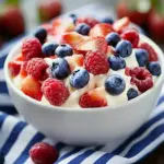 Red, White, and Blue Cheesecake Salad with fresh berries and creamy texture