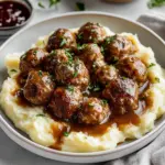 Delicious homemade Swedish meatballs served with creamy sauce and mashed potatoes.